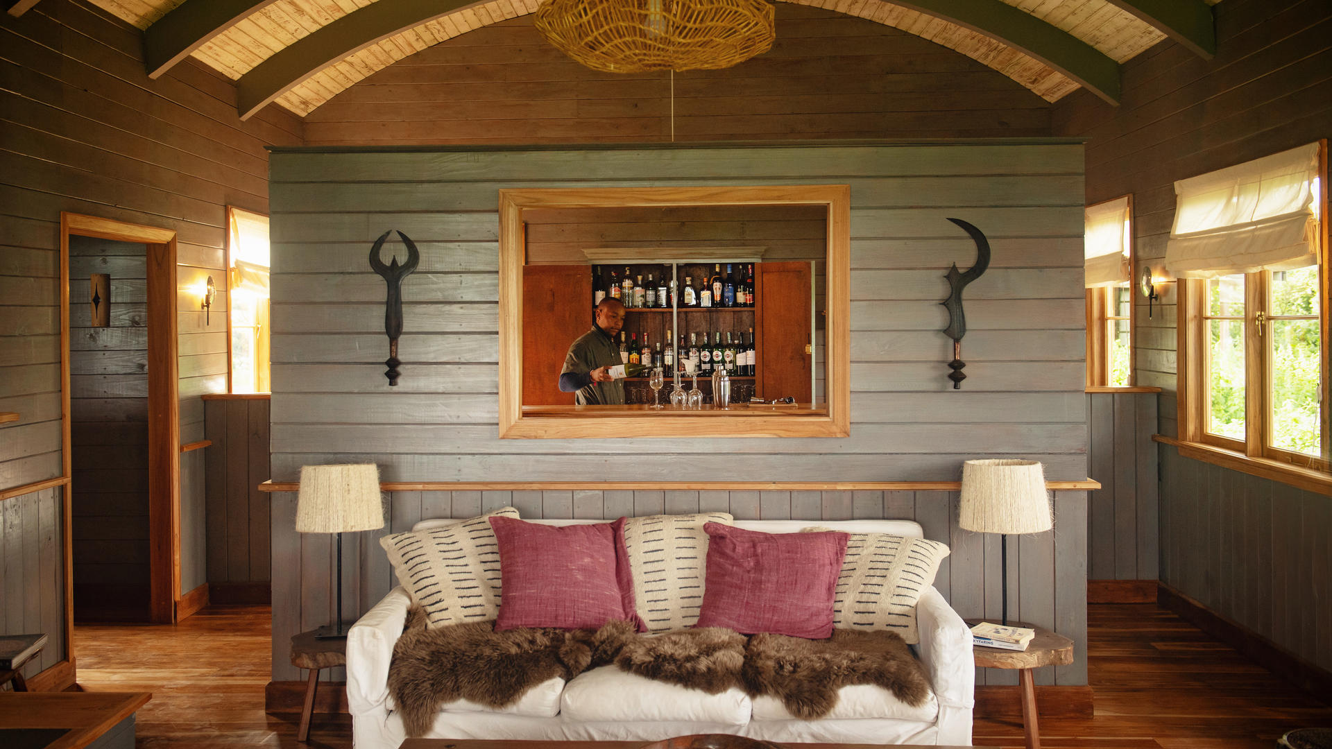 Sundowners are poured in the bar at entamanu