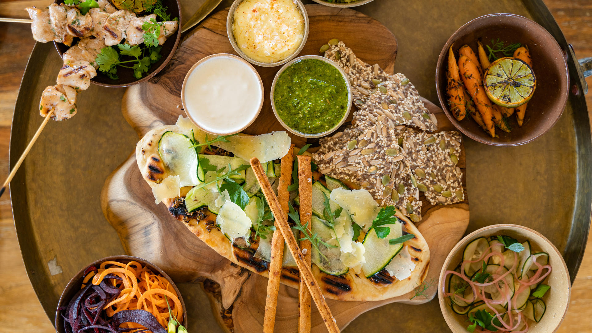 Sasakwa mezze board selection of dipping sauce breadsticks salad osse sinare