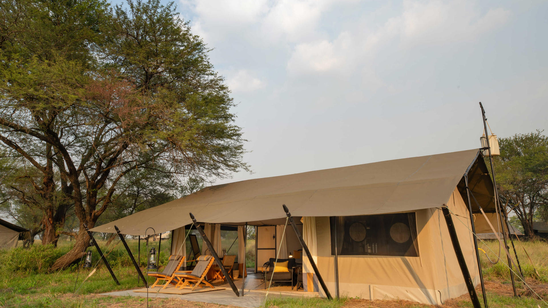 Asilia africa ubuntu migration camp front guest tent exterior
