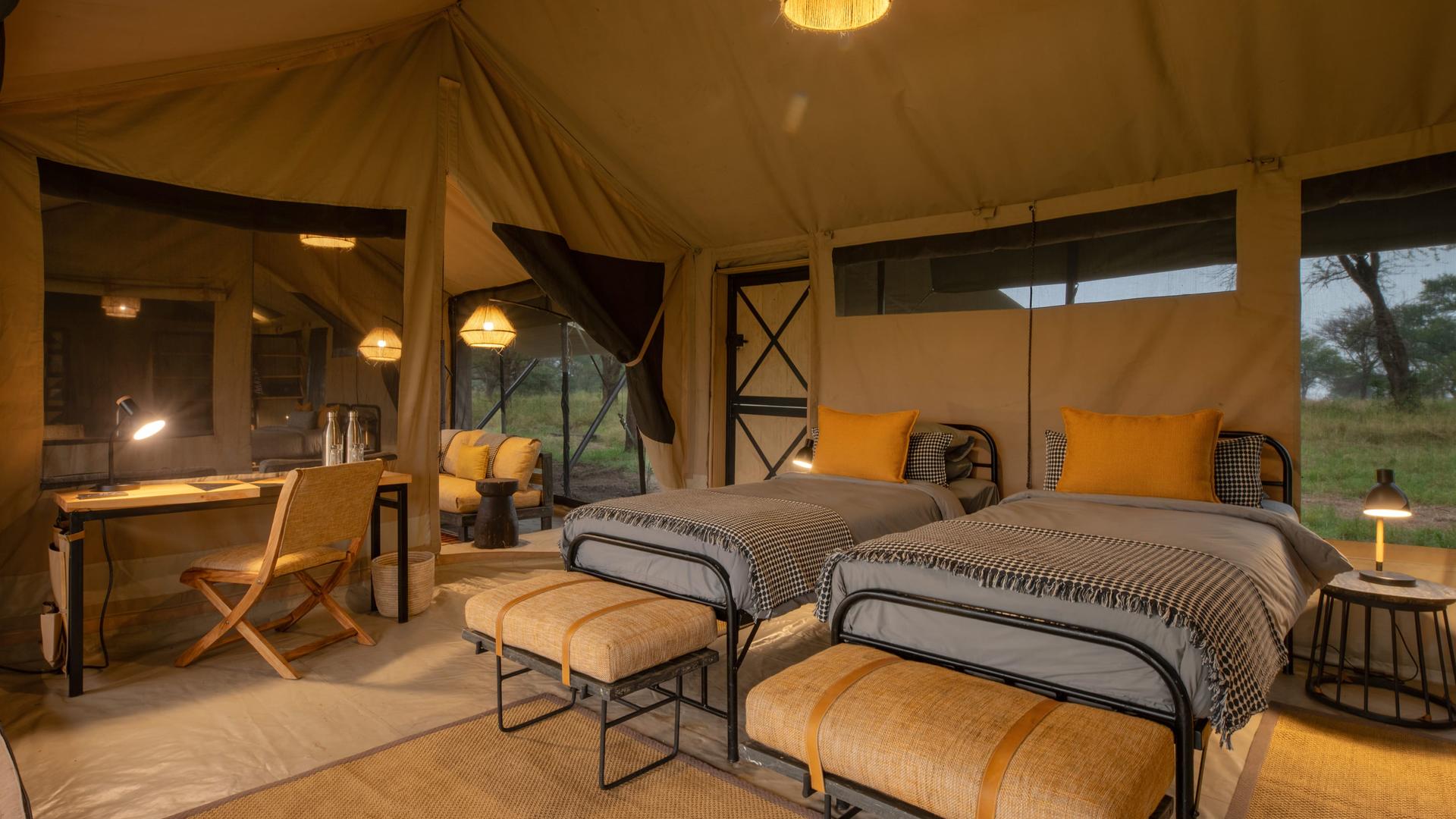 Asilia africa ubuntu migration camp twin room with desk in family tent