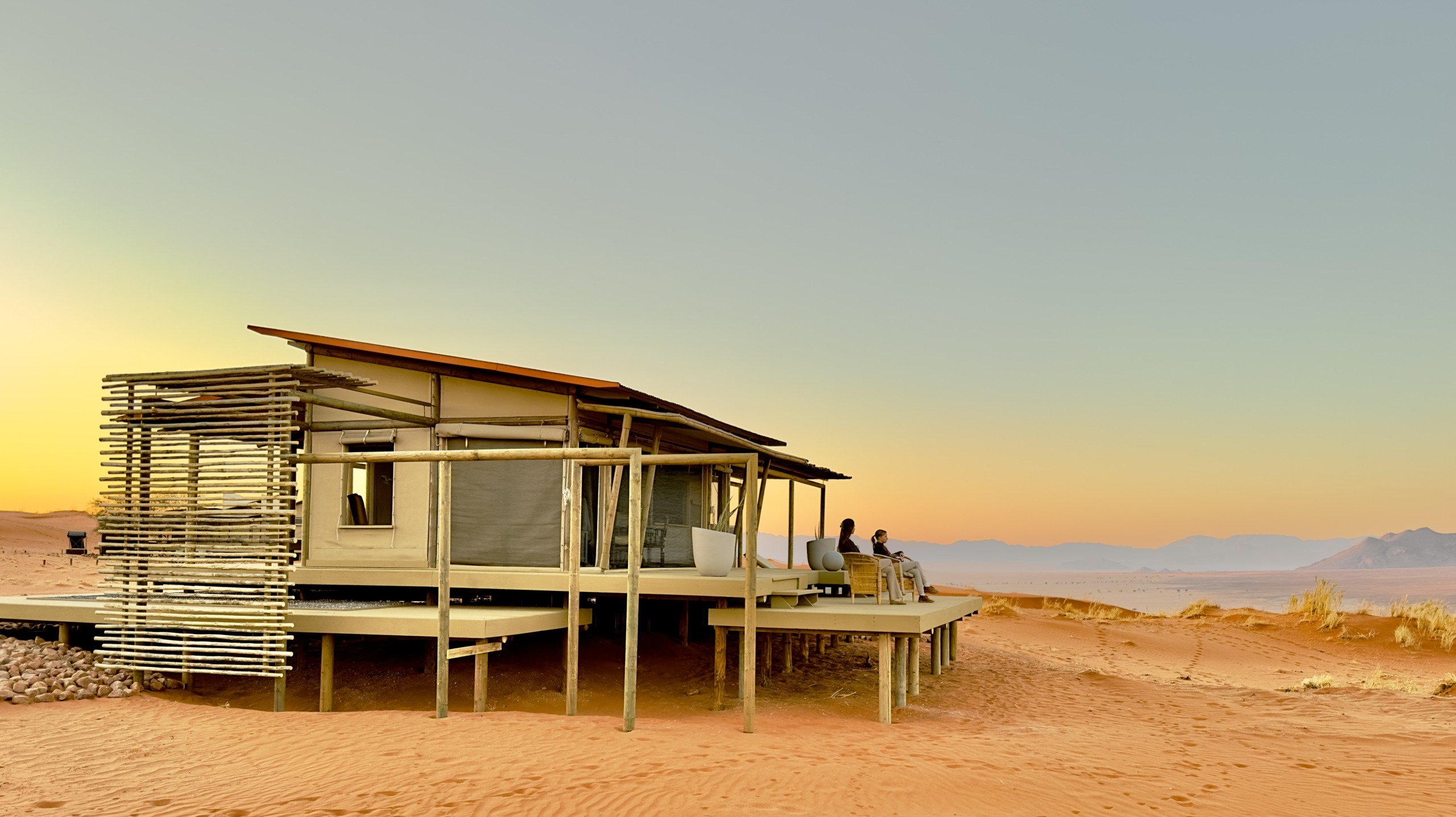 Wolwedans collection desert lodge exterior relaxing on deck yellow