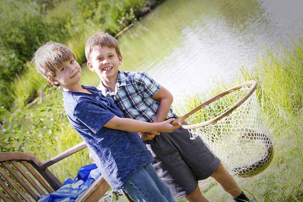 boys with fish in net