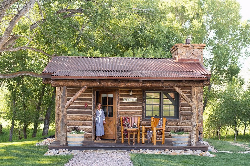 Magee Cabin Exterior ElkHollow Woman Porch FrontView